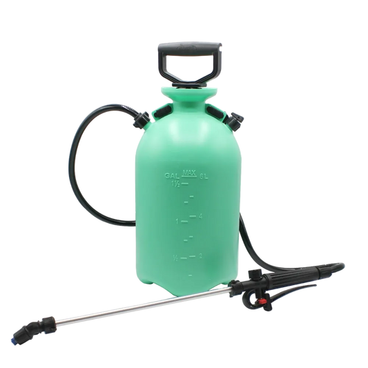 Green spray bottle with black nozzle on a white background